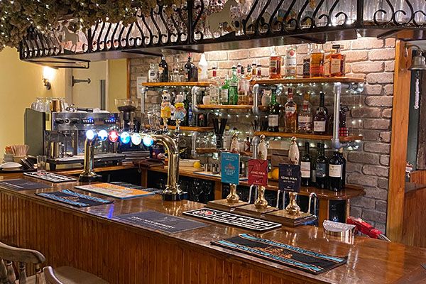 The back bar, stocked with spirits