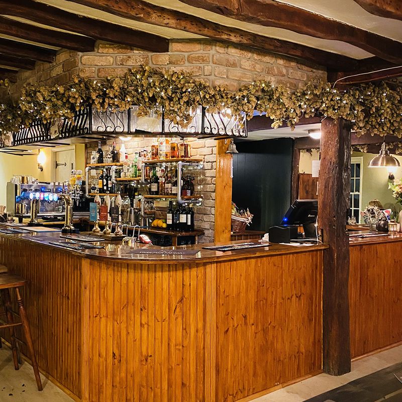 The bar decorated with garlands and fairy lights