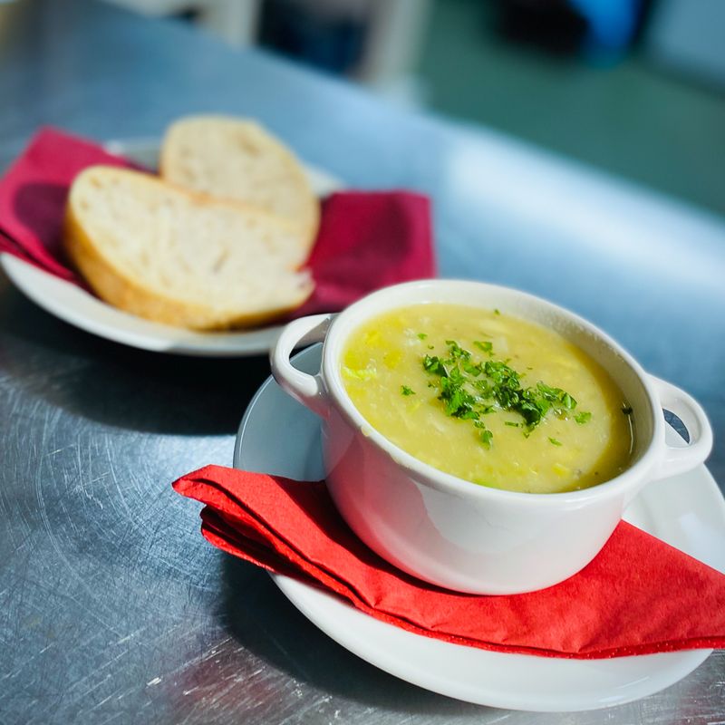 A bowl of homemade soup with bread