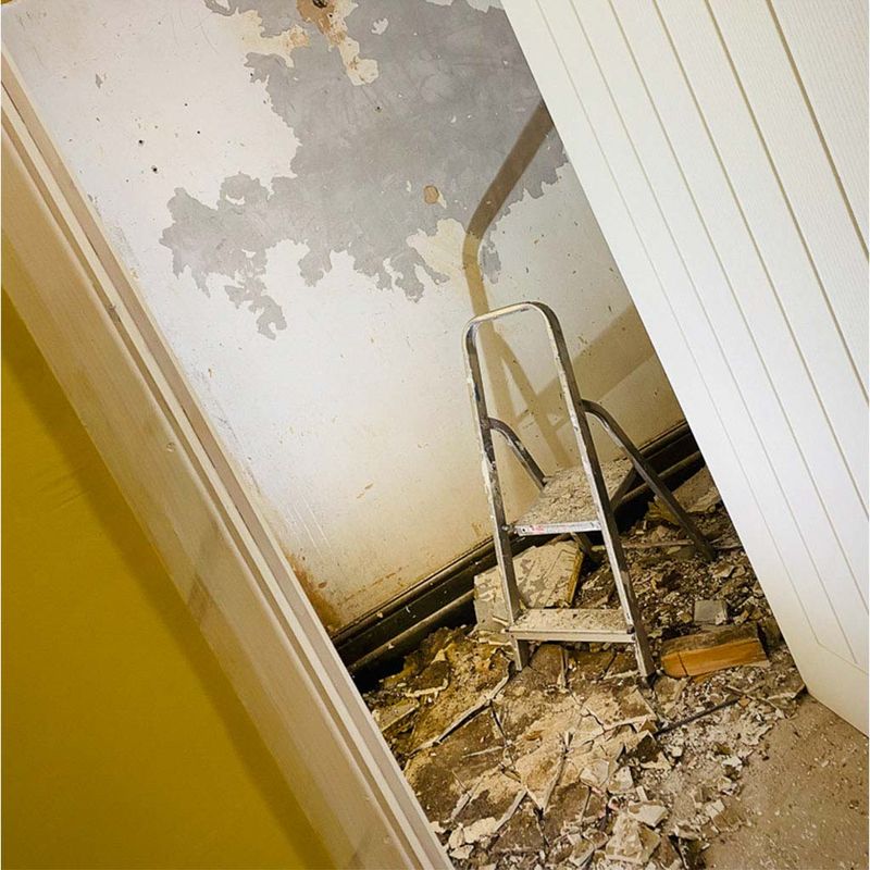 Failed plaster and damp in a corner
